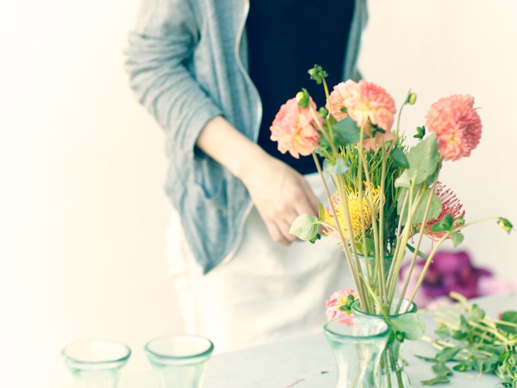 Floral still life photography with flowers arranged in a glass vase